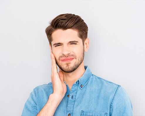 man with jaw soreness due to TMJ